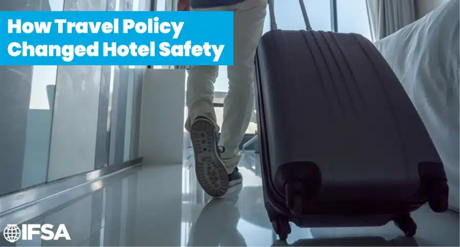 How Travel Policy Changed Hotel Safety 2 How Travel Policy Changed Hotel Safety - traveler pulling a suitcase through a hotel room